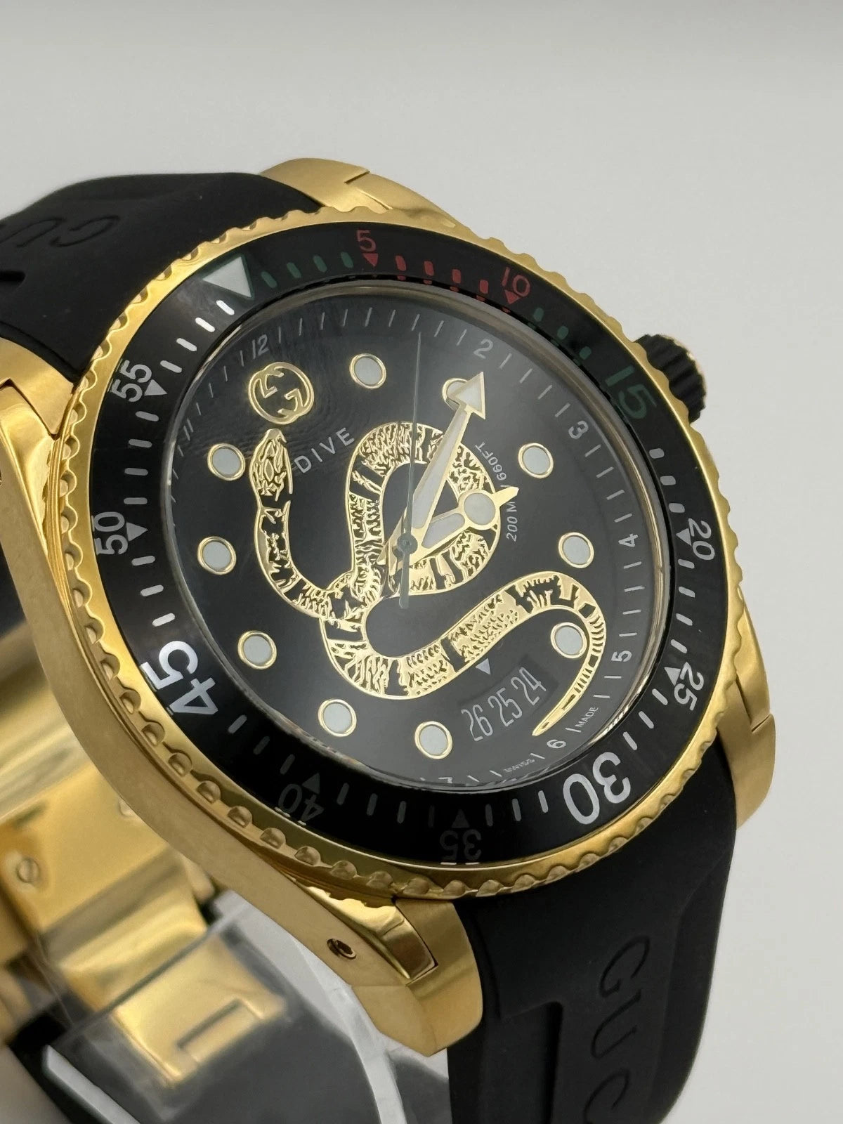 Gucci Dive Black Dial Gold-Tone Rubber Strap 45mm. Men's Watch YA136219