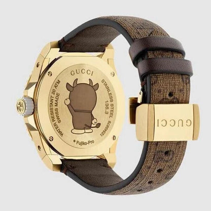 Gucci Dive Doraemon YA136334 Unisex Watch – Gold PVD Case with Brown Canvas Dial